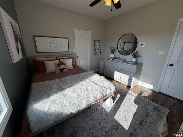 bedroom featuring dark hardwood / wood-style floors and ceiling fan