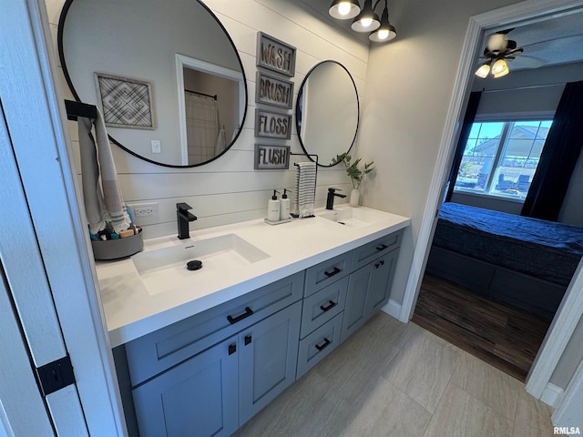 bathroom with ceiling fan and vanity