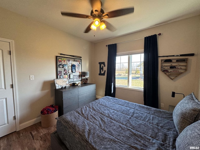 bedroom featuring wood-type flooring and ceiling fan