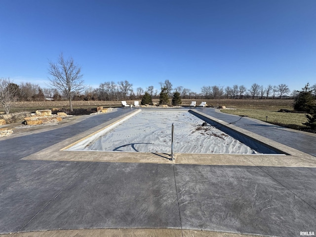 view of pool featuring a rural view