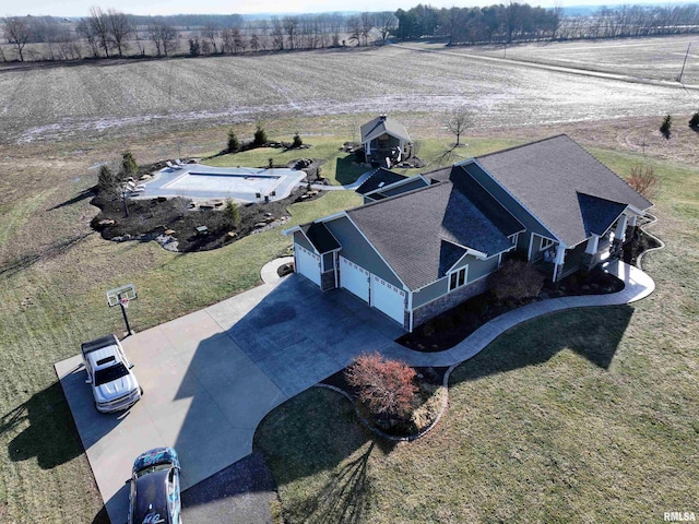 birds eye view of property with a rural view