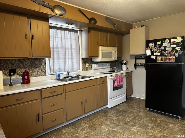 kitchen featuring white appliances, sink, a textured ceiling, and backsplash