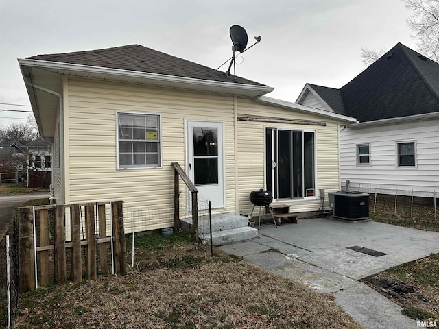 back of property featuring a patio and central air condition unit