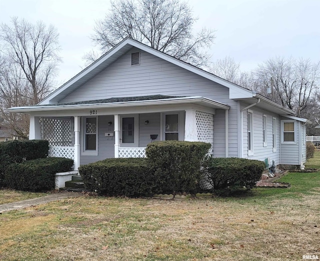 view of front of home with a front lawn and a porch