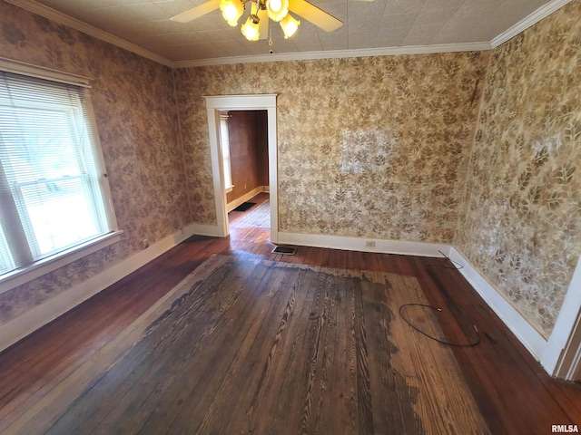 spare room featuring ceiling fan, ornamental molding, and dark hardwood / wood-style flooring