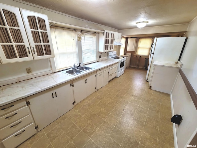 kitchen with white cabinetry, sink, a textured ceiling, and electric stove