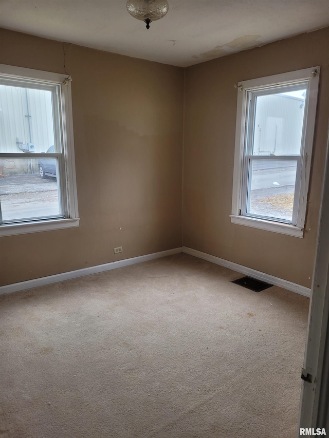 unfurnished room with carpet floors