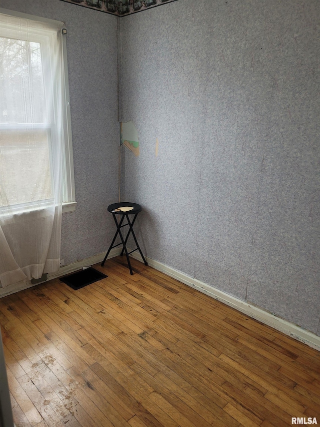 empty room featuring hardwood / wood-style flooring