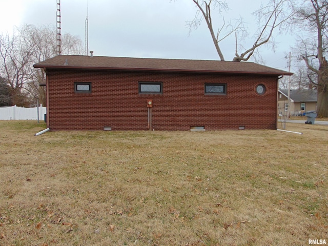 view of property exterior with a lawn