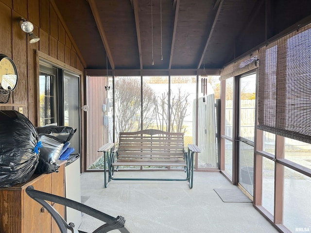 sunroom / solarium with lofted ceiling and plenty of natural light