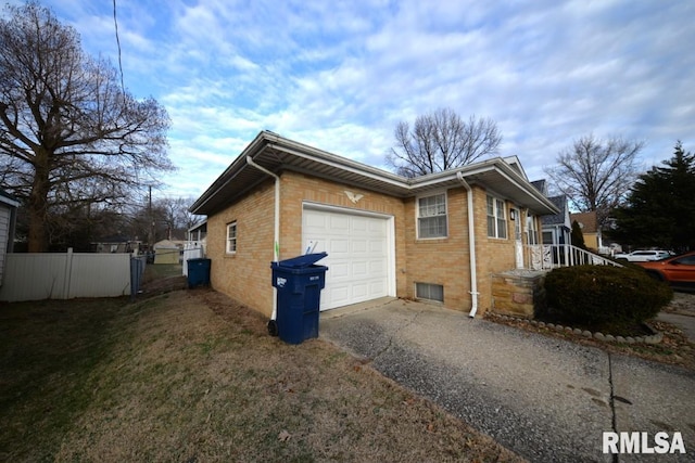 view of side of property with a garage