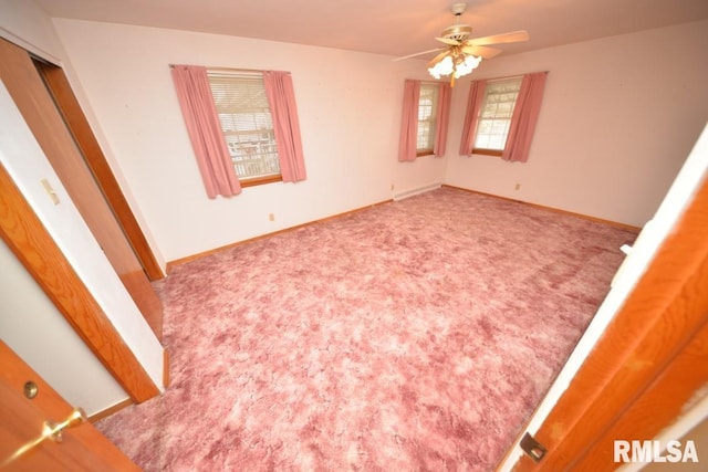 spare room with carpet and ceiling fan