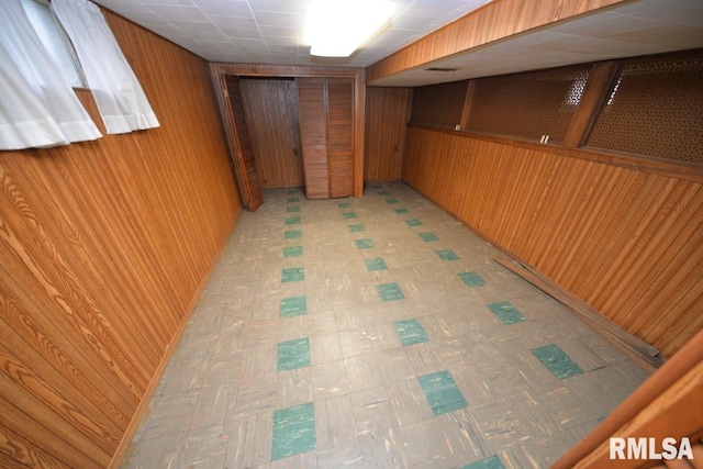 basement with wooden walls