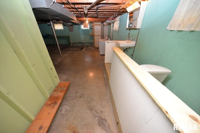 interior space with washer and clothes dryer and sink