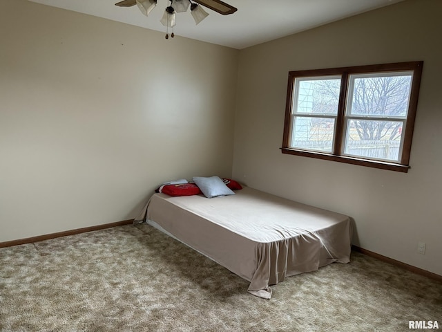 carpeted bedroom featuring vaulted ceiling and ceiling fan