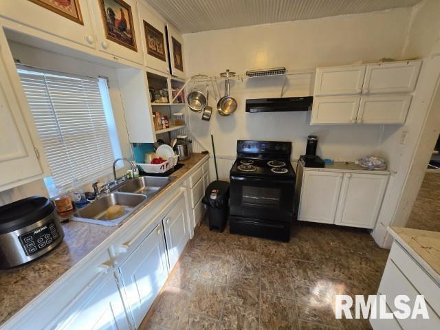 kitchen featuring white cabinetry, black range with electric stovetop, and sink