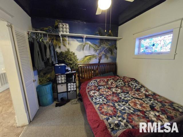 carpeted bedroom featuring a closet