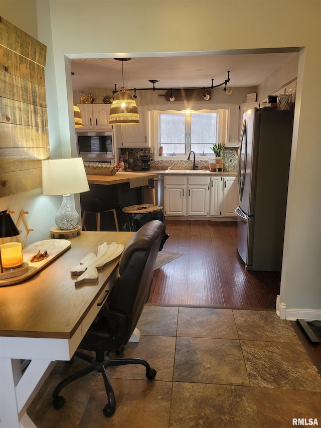 office featuring dark wood-type flooring and sink