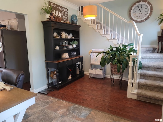 interior space with crown molding and hardwood / wood-style flooring