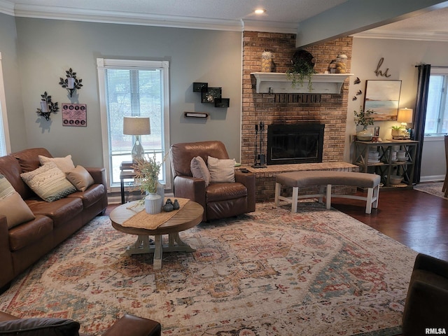 living room featuring a brick fireplace, crown molding, and dark hardwood / wood-style floors