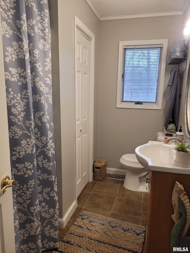 bathroom with crown molding, tile patterned floors, vanity, and toilet