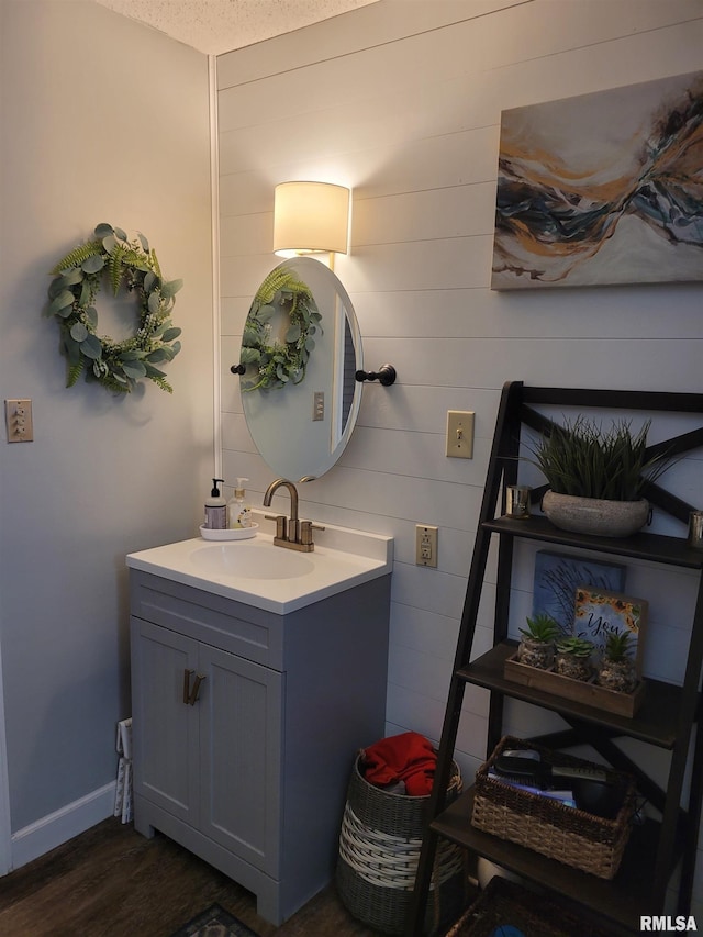 bathroom featuring hardwood / wood-style flooring and vanity