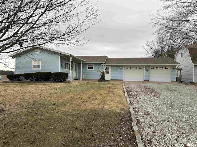 single story home featuring a garage and a front lawn