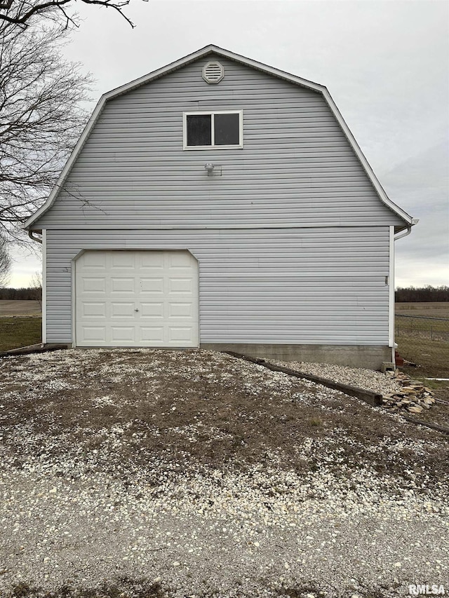 view of property exterior featuring a garage