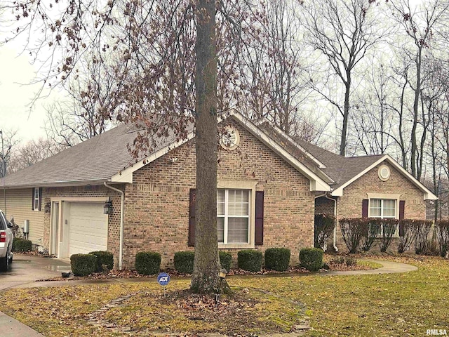 view of front of house with a garage and a front yard