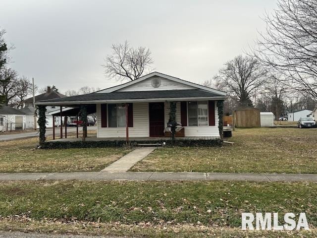 view of front of house with a porch and a front lawn