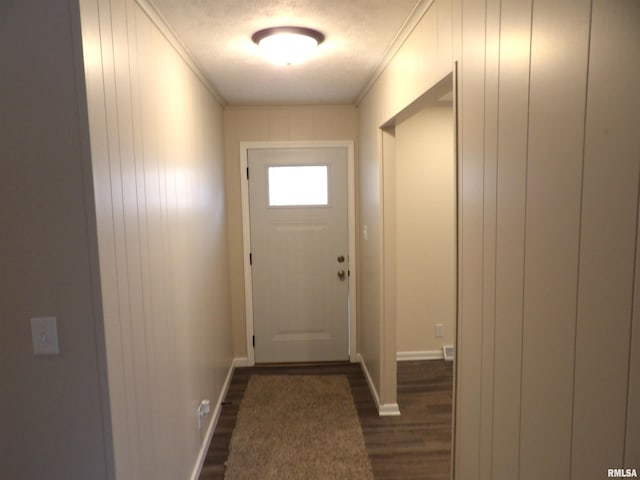 doorway to outside featuring dark wood-type flooring and ornamental molding