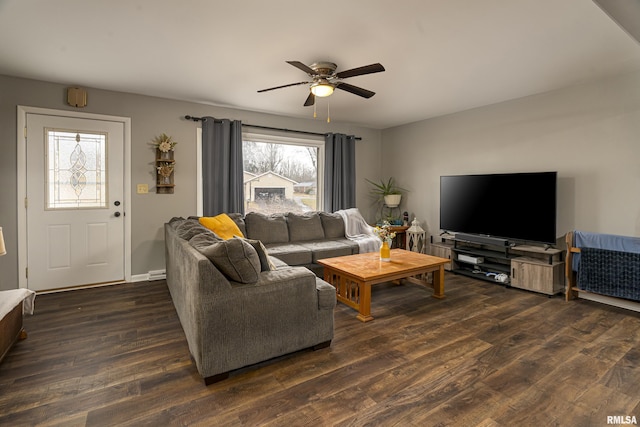 living room with dark wood-type flooring and ceiling fan