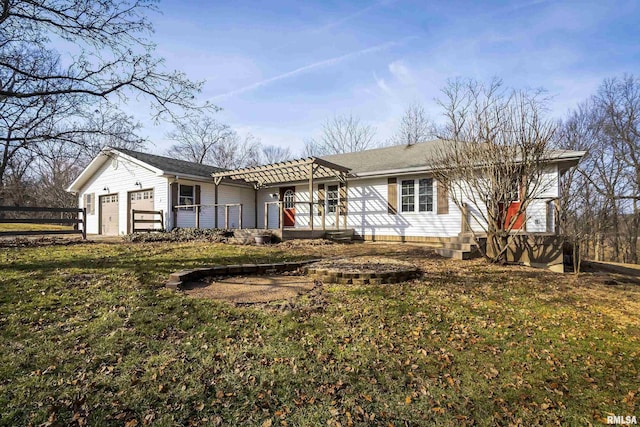 ranch-style house with a garage and a front lawn