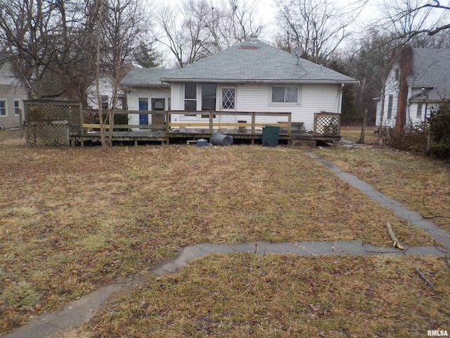 rear view of house with a wooden deck