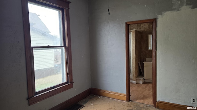 empty room featuring plenty of natural light