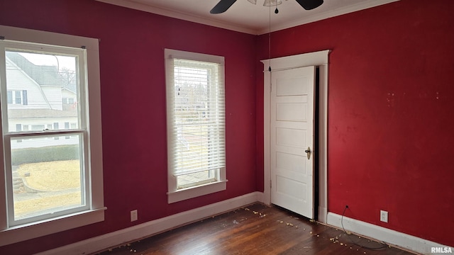 unfurnished room featuring ceiling fan, ornamental molding, and dark hardwood / wood-style flooring