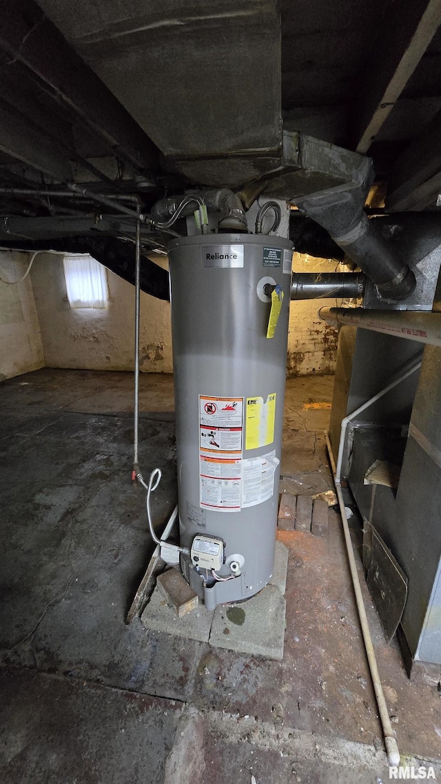 utility room featuring water heater