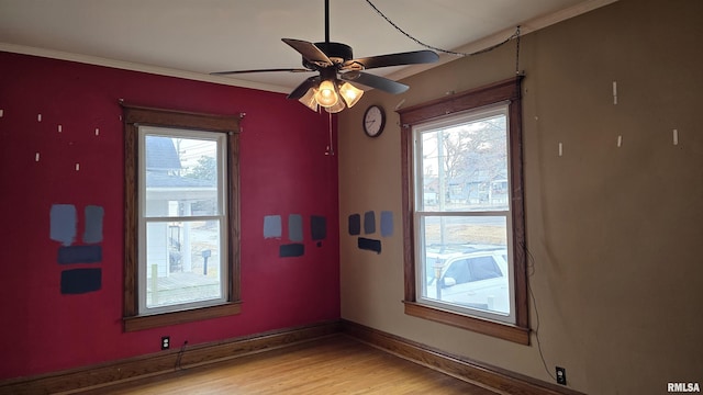 unfurnished room featuring ceiling fan, ornamental molding, and light hardwood / wood-style floors