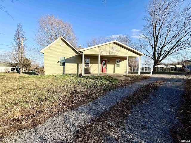 single story home featuring covered porch