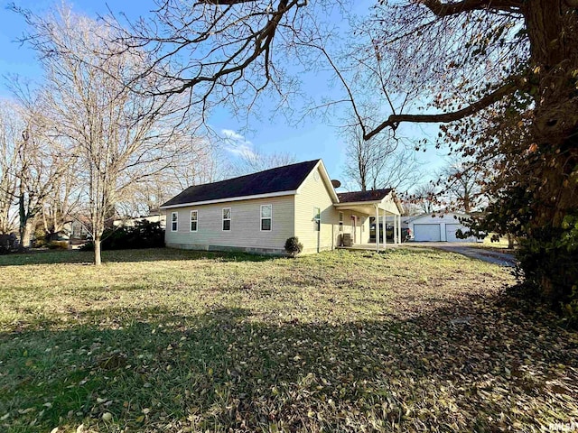 view of home's exterior featuring a garage and a yard