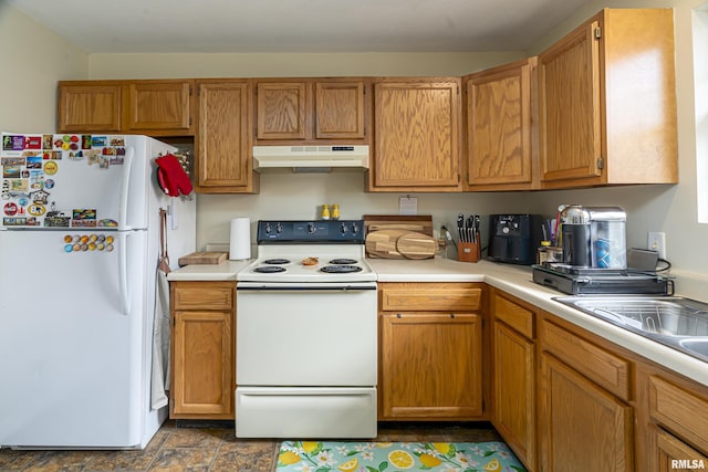 kitchen featuring sink and white appliances