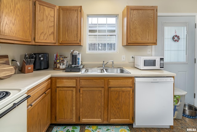 kitchen with sink and white appliances