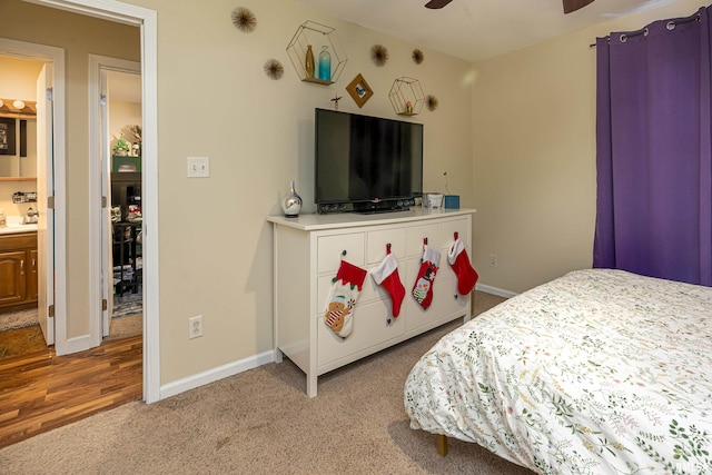 bedroom featuring light colored carpet