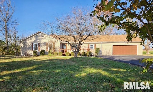 single story home with a garage and a front yard