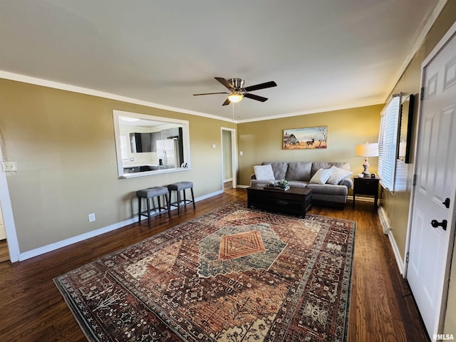 living room with ornamental molding, ceiling fan, dark hardwood / wood-style flooring, and baseboard heating