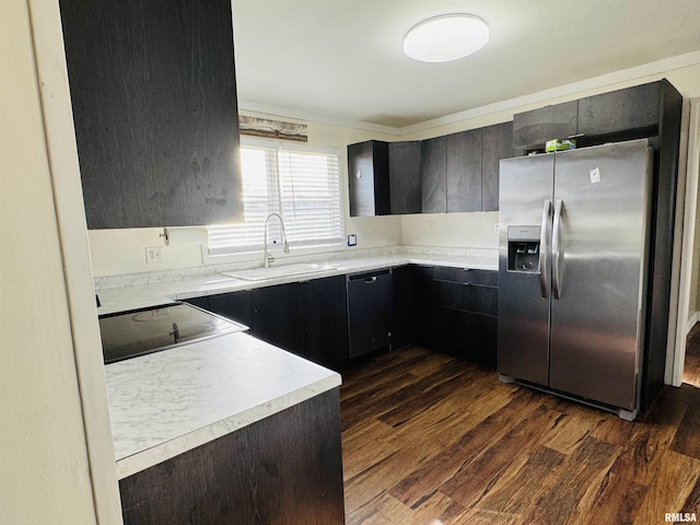 kitchen with dark hardwood / wood-style flooring, sink, and black appliances