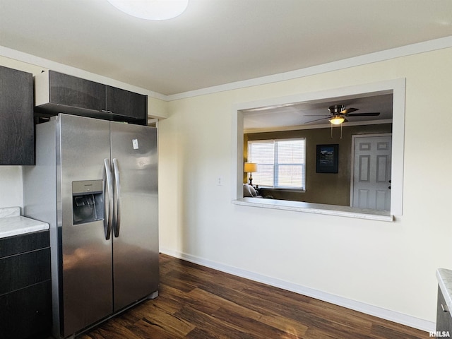 kitchen with crown molding, dark wood-type flooring, ceiling fan, and stainless steel refrigerator with ice dispenser