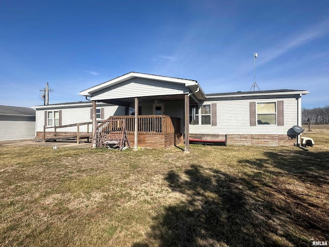 view of front of property with a front lawn and a deck