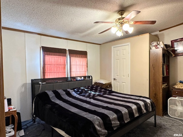 carpeted bedroom with ceiling fan, ornamental molding, and a textured ceiling