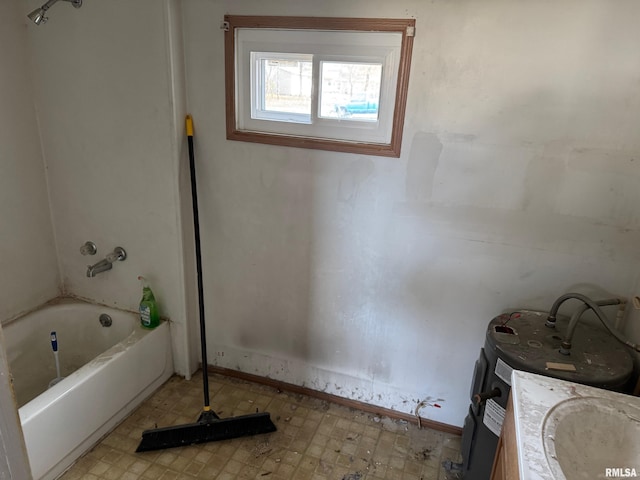 bathroom featuring vanity and a tub to relax in